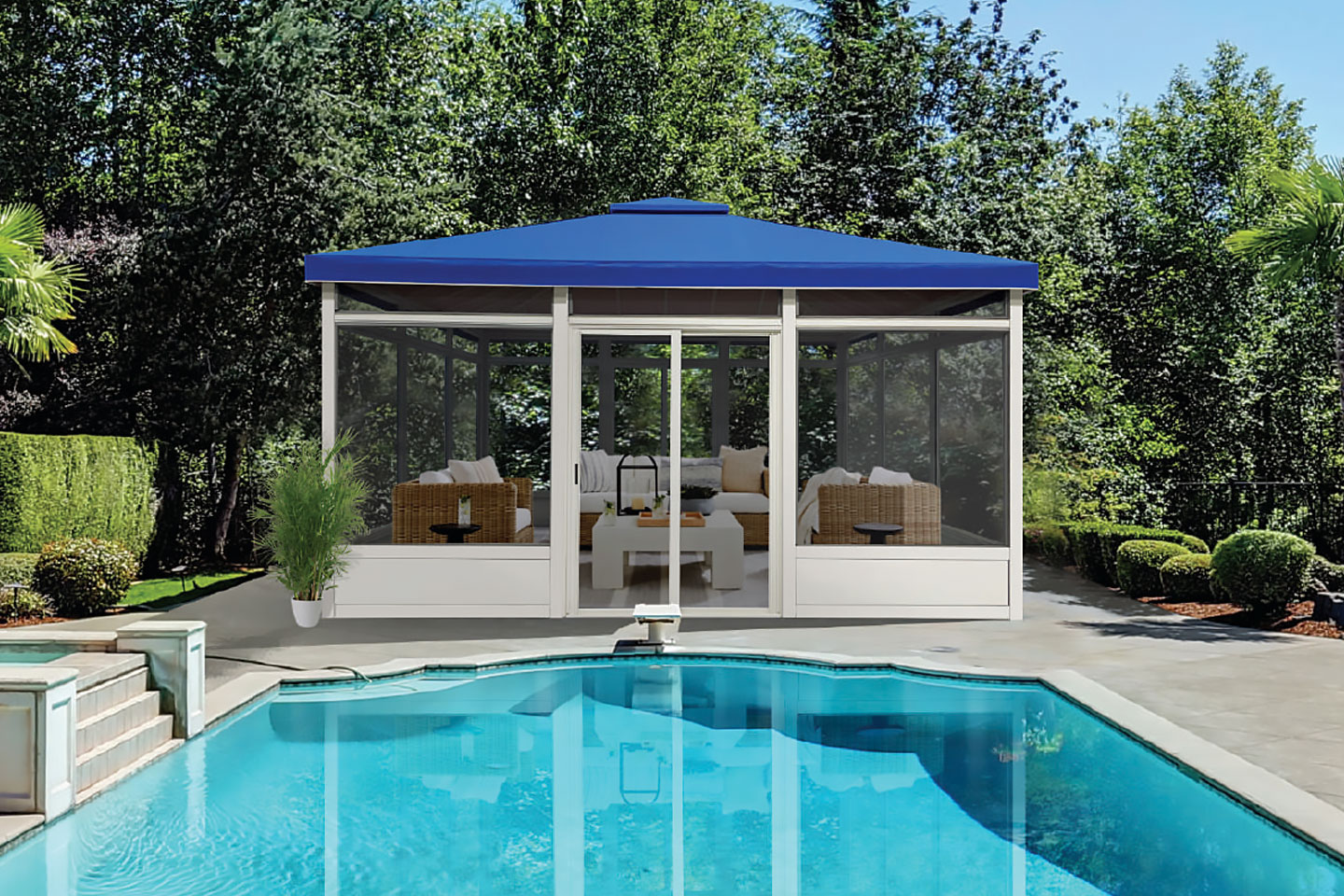 Luxury backyard featuring a large tan motorized retractable awning by Decadent Outdoors, providing custom shade over a modern poolside patio and manicured turf lawn with a scenic golf course and mountain view.